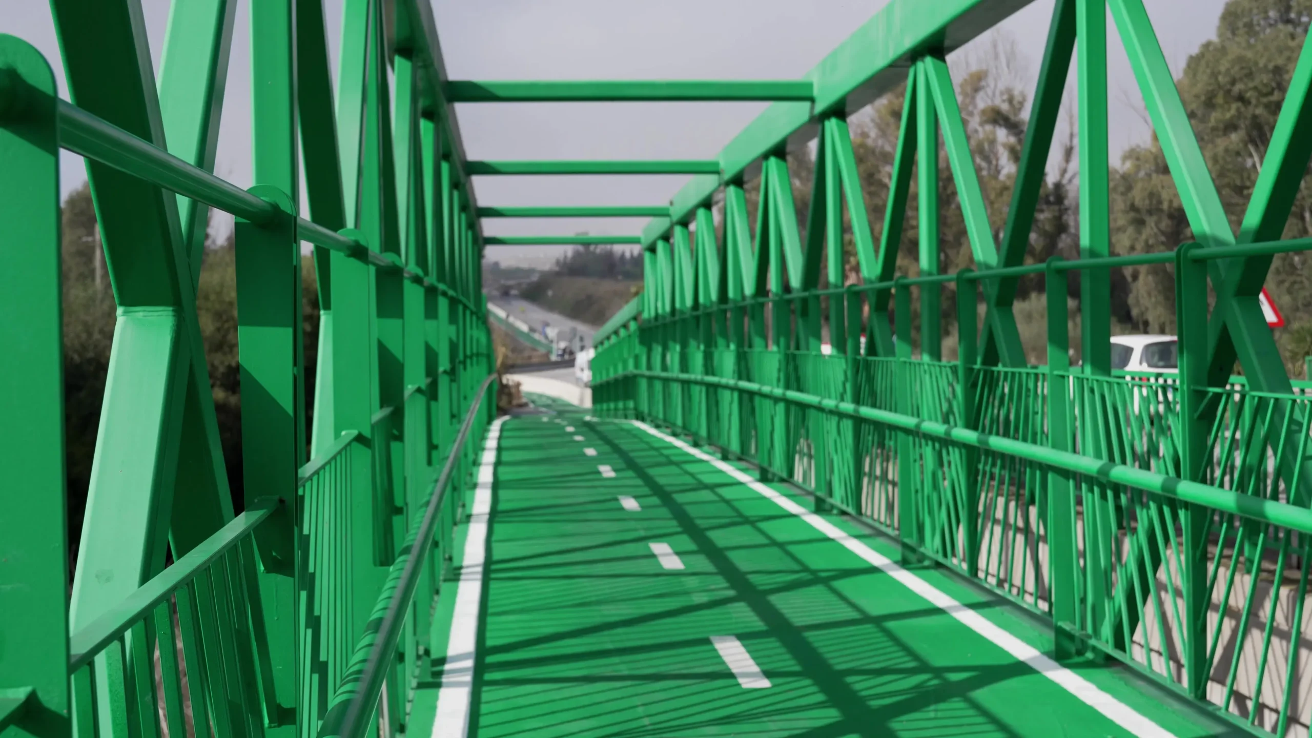 green metal bridge prepared cyclists scaled